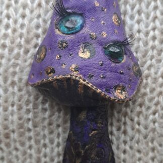 Гриб фиолетово-черный глазастый